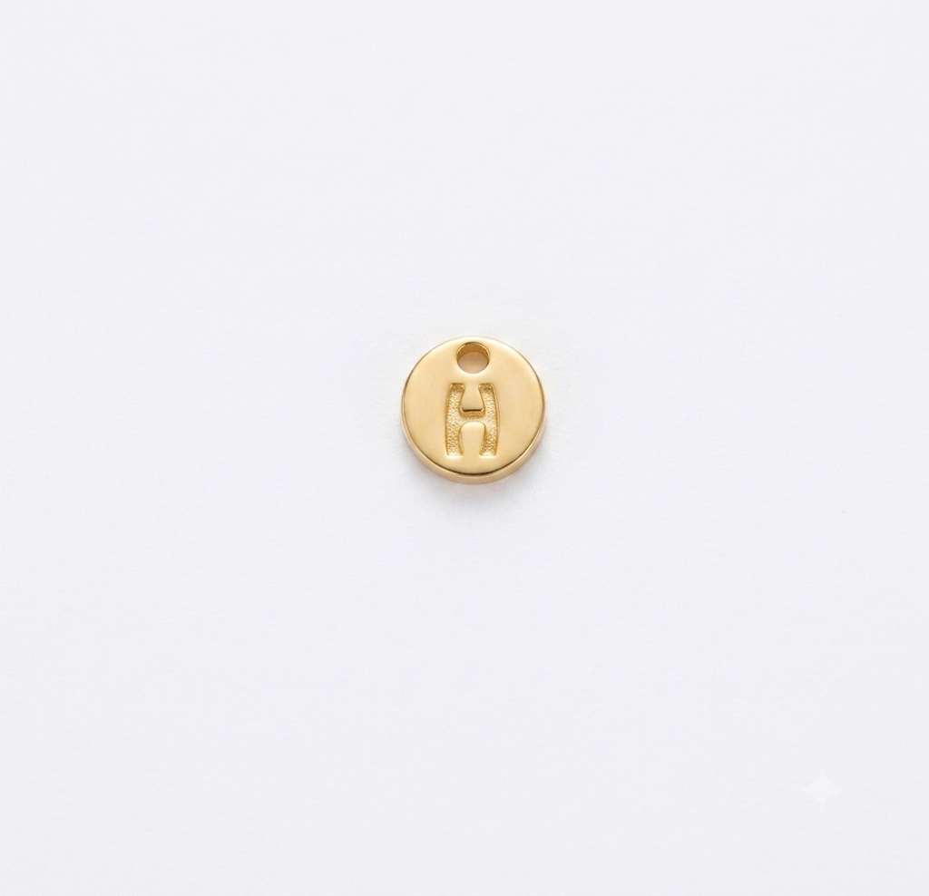 Lettere in zama in stampatello su base tonda mm. 7 colore oro opaco free ( pack pz. 1 )